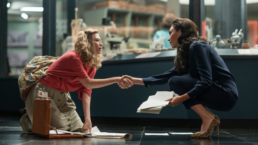 KRISTEN WIIG as Barbara Minerva and GAL GADOT as Diana Prince in Warner Bros. Pictures’ action adventure “WONDER WOMAN 1984,” a Warner Bros. Pictures release